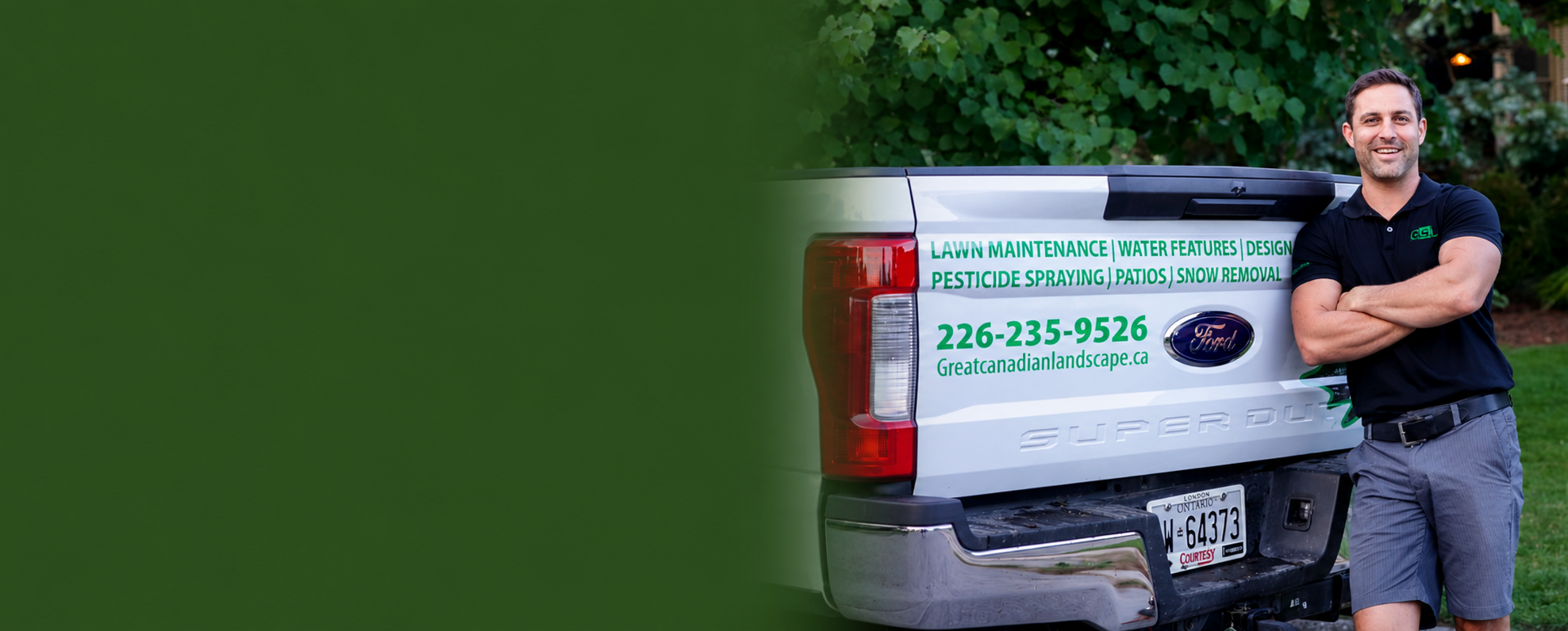 Professional landscaper Dan leaning against Great Canadian Landscape truck in London, Ontario