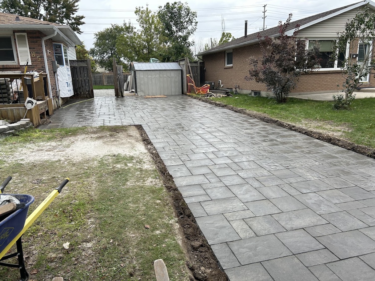Full interlocking paver stone driveway and backyard patio extension in London, Ontario