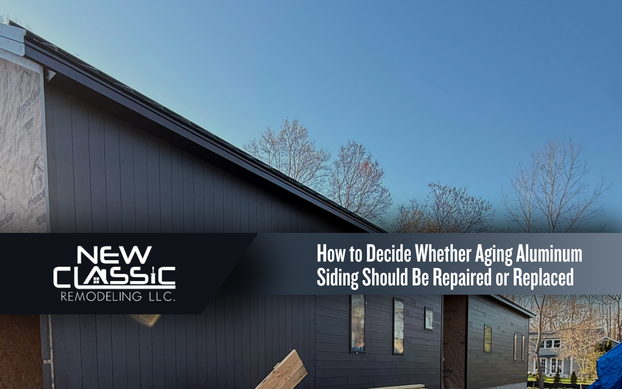 Older aluminum siding showing dents, fading, and loose panel areas on a home
