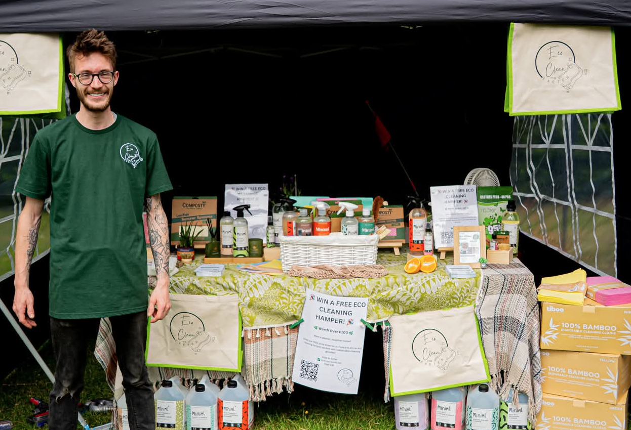 Joey from Eco Clean Exeter with Dyson vacuum, mop and eco-friendly cleaning products.