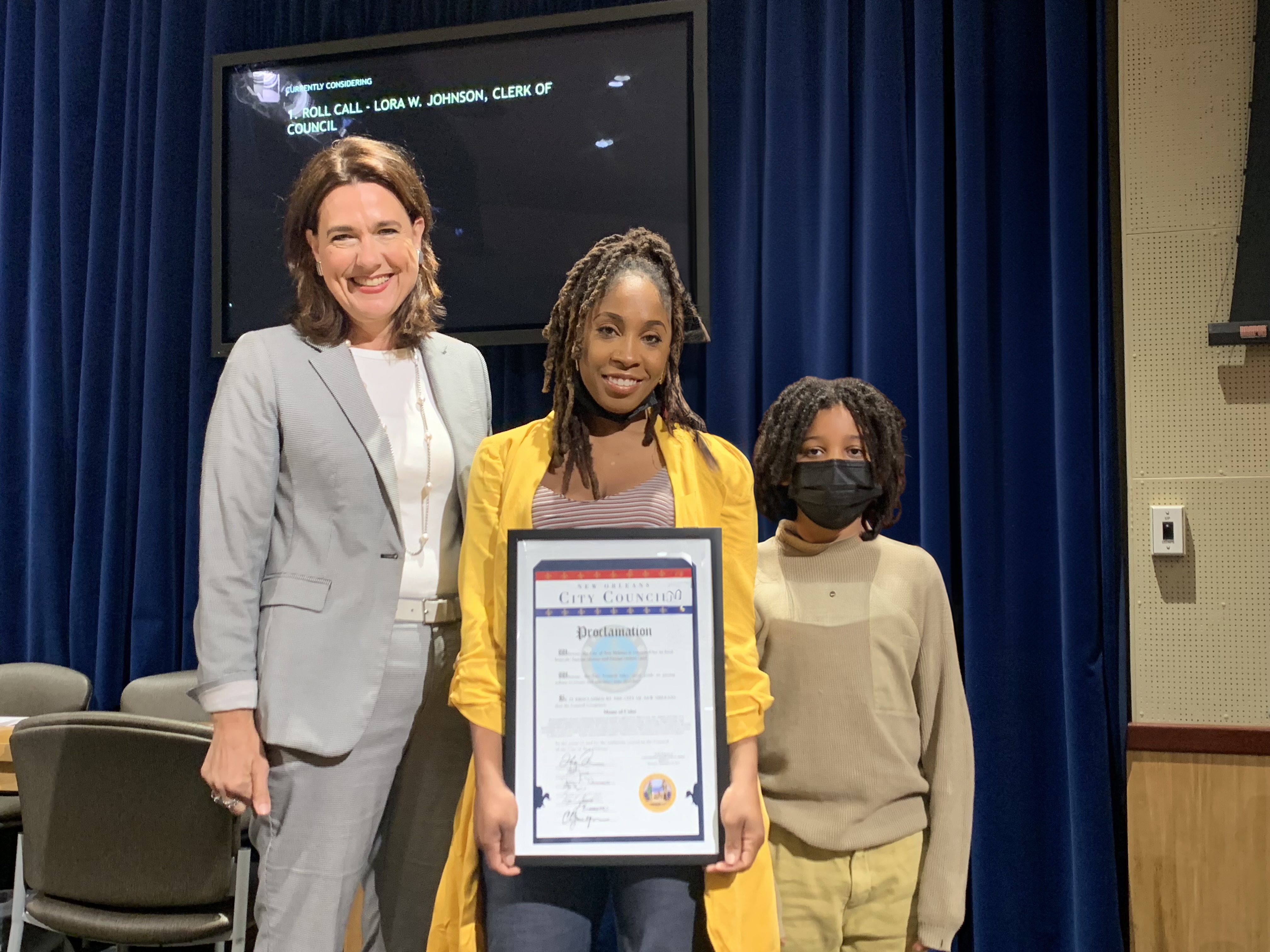Proclamation Day ceremony in New Orleans with city official and son