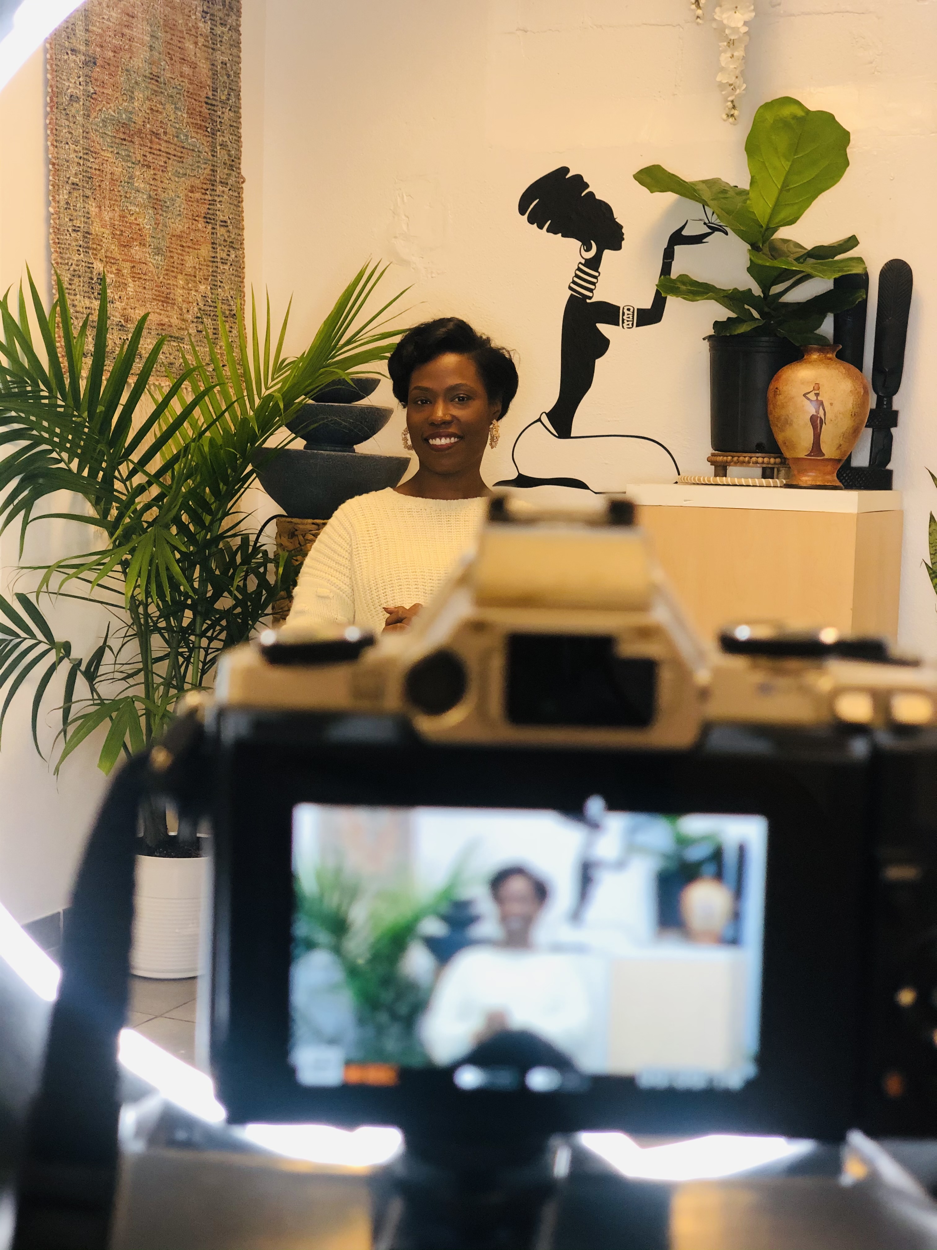 A woman getting ready to share her story on camera