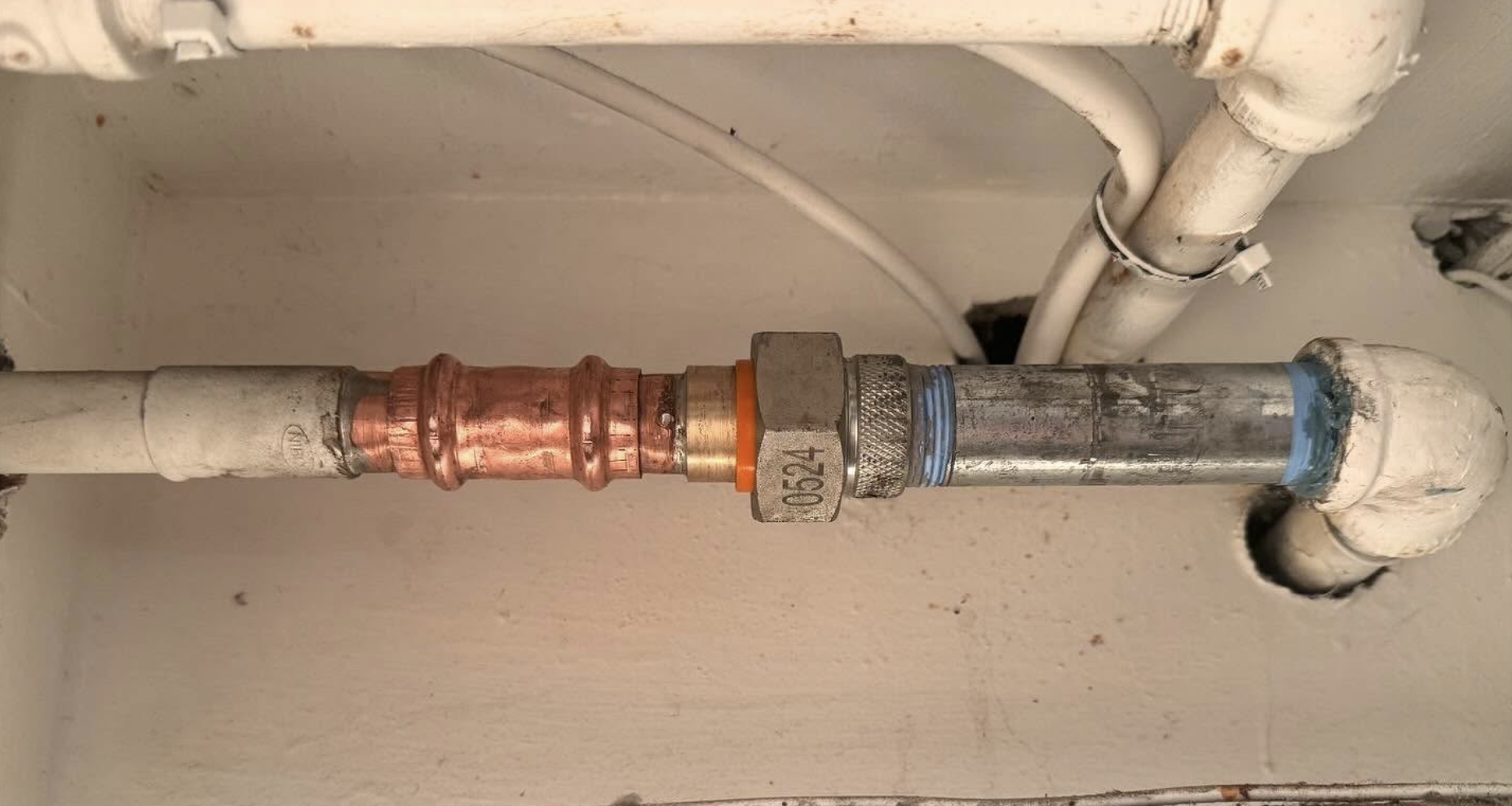 After repiping - new shiny copper pipe with professional brass fittings