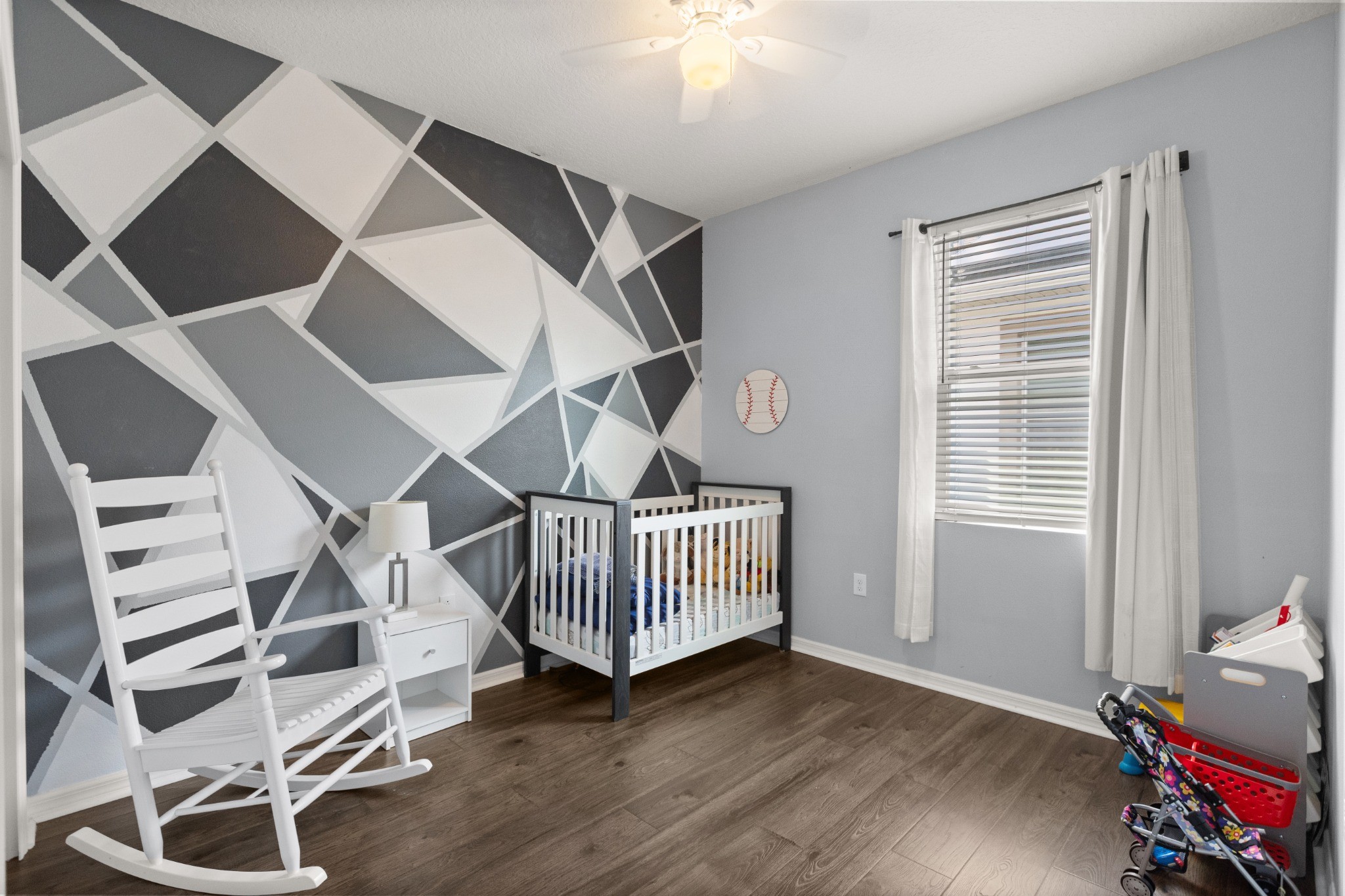 2401 Avian Loop Kissimmee FL - Additional secondary bedroom with window, wood-look flooring, and ceiling fan