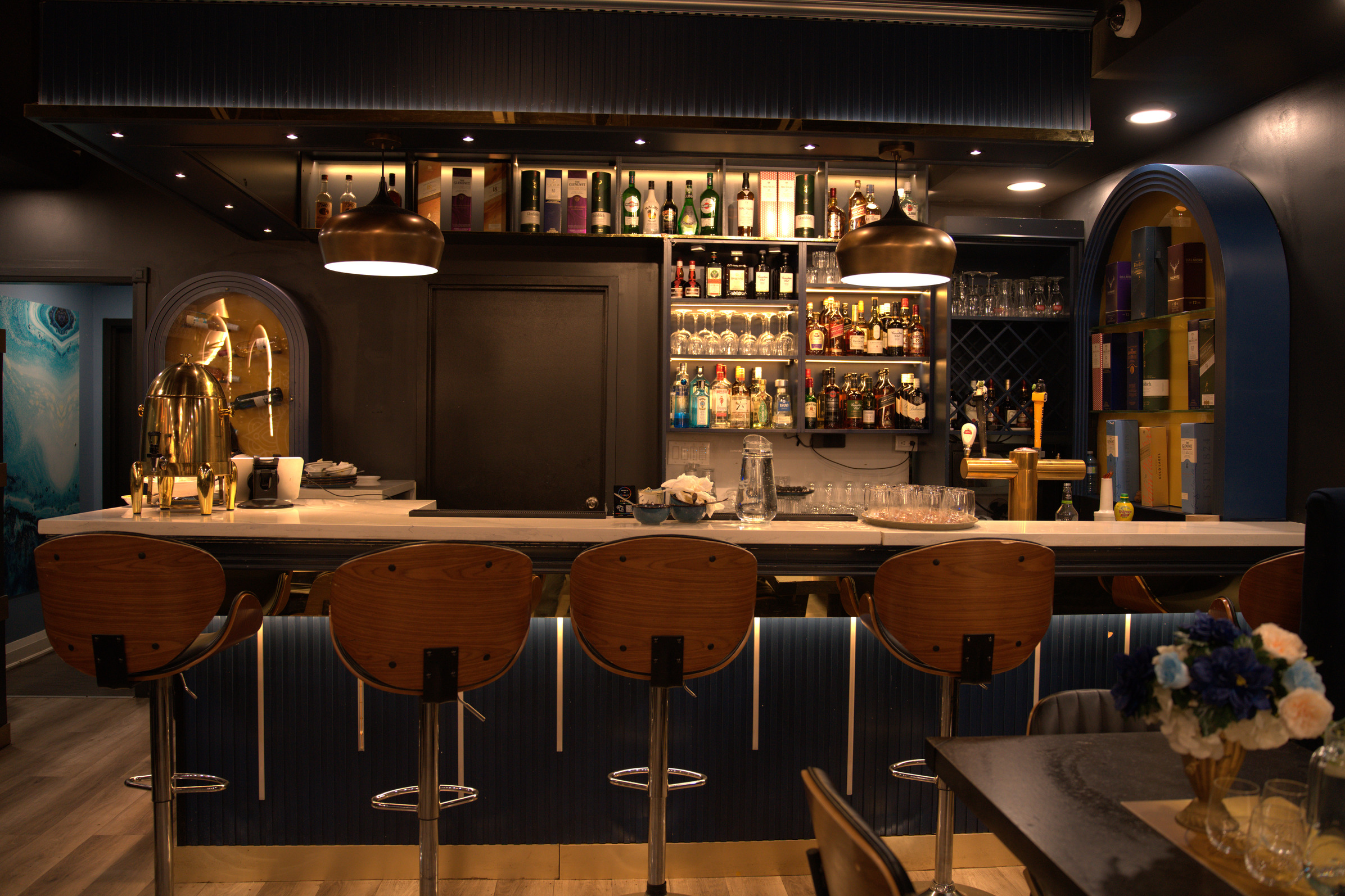 Full service bar at Khatirdari Brampton venue with premium liquor selection and gold accents