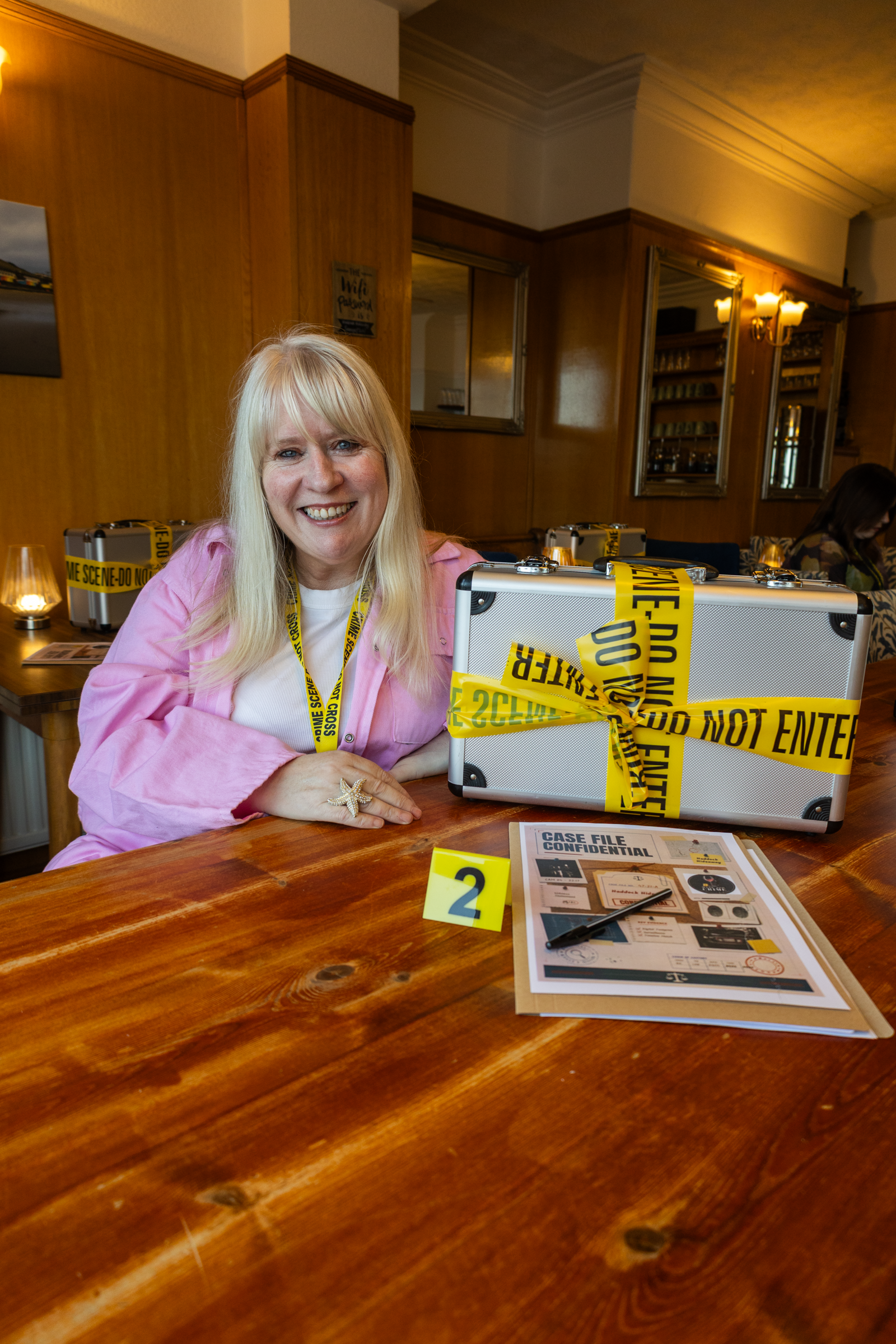 Tina Treacy with forensic case file and investigation kit