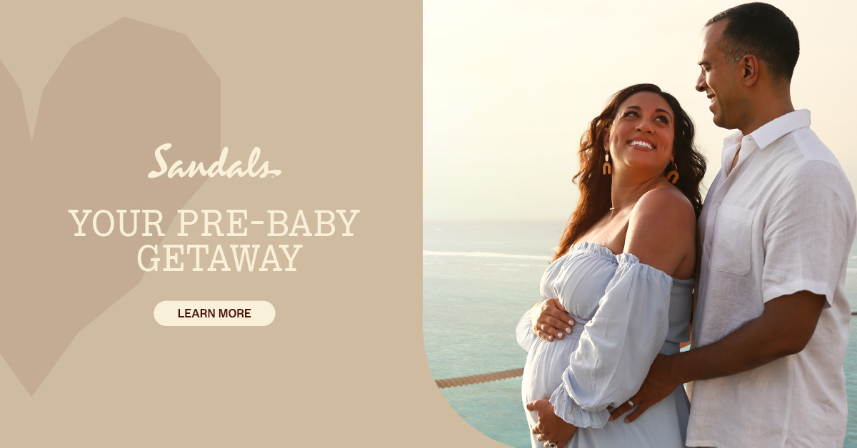 Expecting couple enjoying their babymoon at a Sandals resort