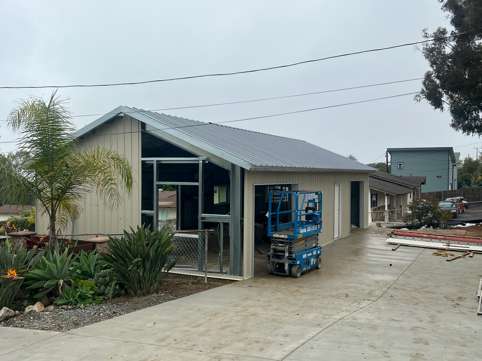 Prefab steel building with metal roofing and exterior cladding nearing completion.