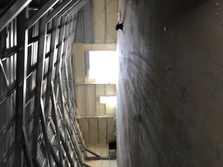 Open interior of a finished insulated metal warehouse building.