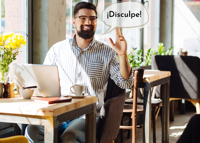 Disculpe — how to say excuse me in Spanish to get the server's attention at a restaurant in Mexico, one of 10 essential Spanish restaurant phrases for dining out