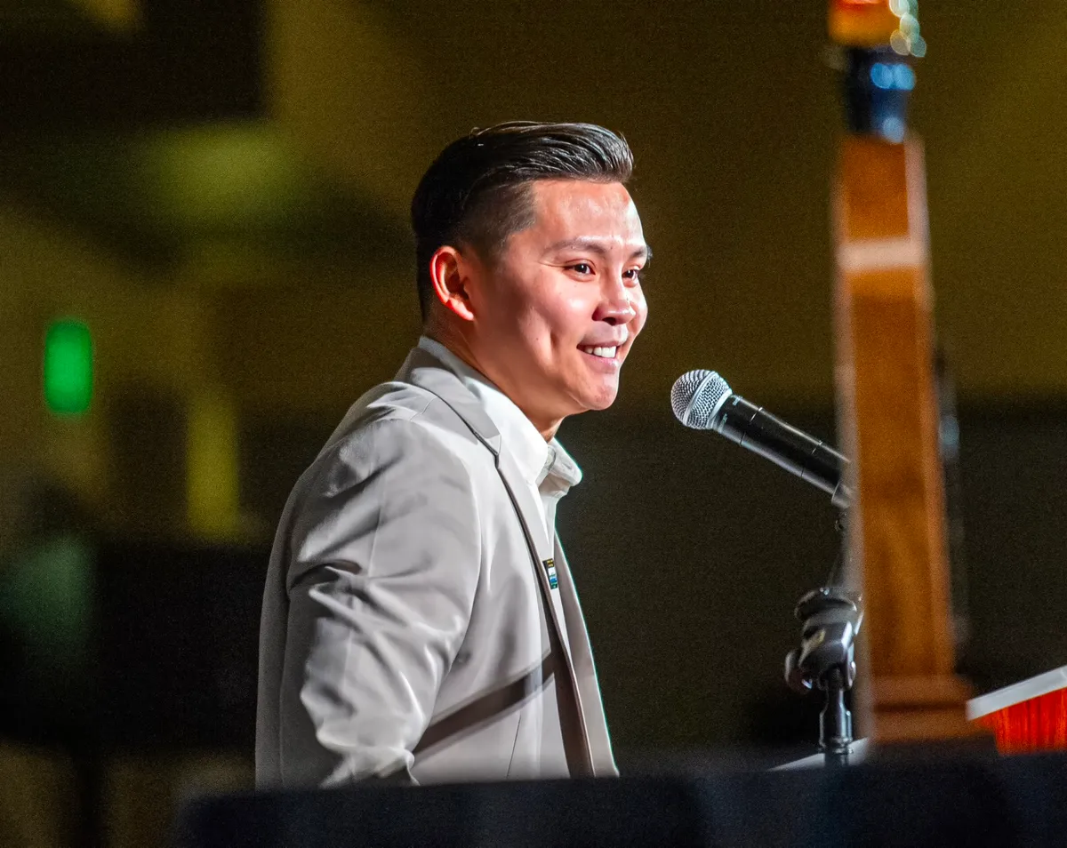 Youth motivational speaker Ton Nguyen presenting to students at a school event