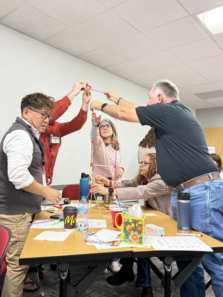 Ton Nguyen facilitating an interactive team-building activity with workshop participants