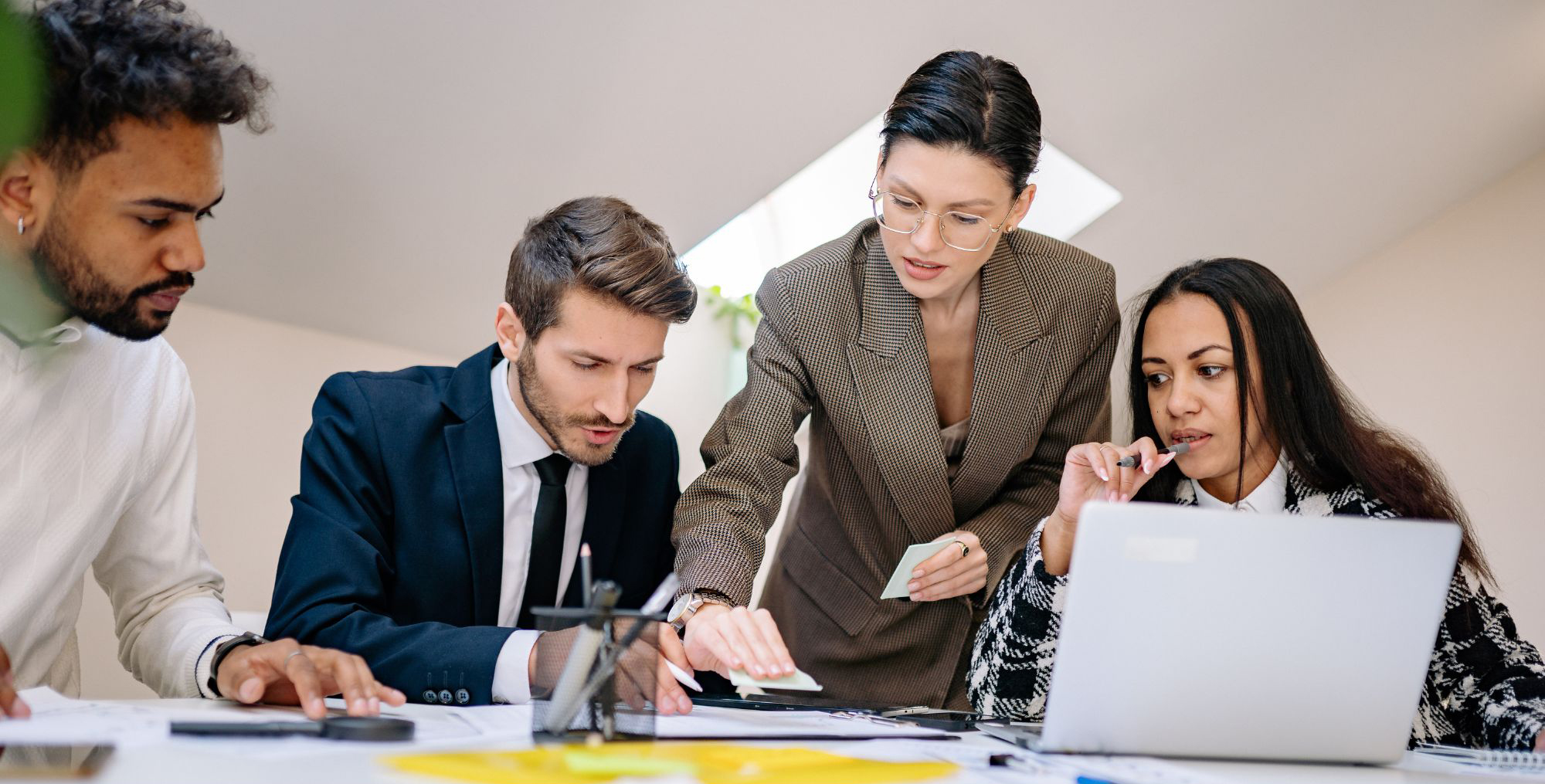 Professional team collaboration, employees and boss at a desk