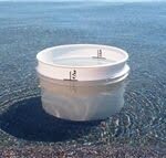 Bucket placed on pool steps