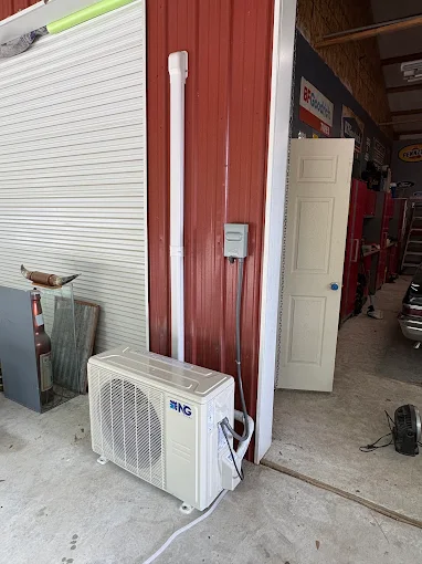 Professional white line-hide conduit covering copper refrigerant lines in Katy