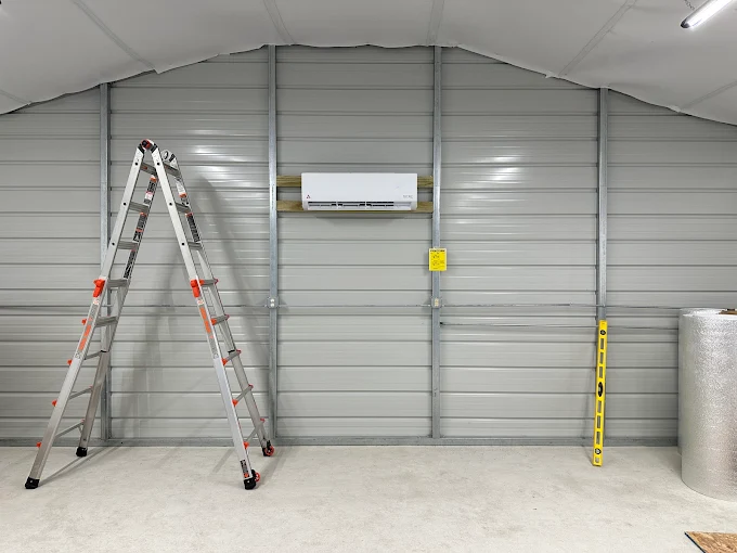 Wall-mounted indoor mini split air handler inside metal building in Cypress