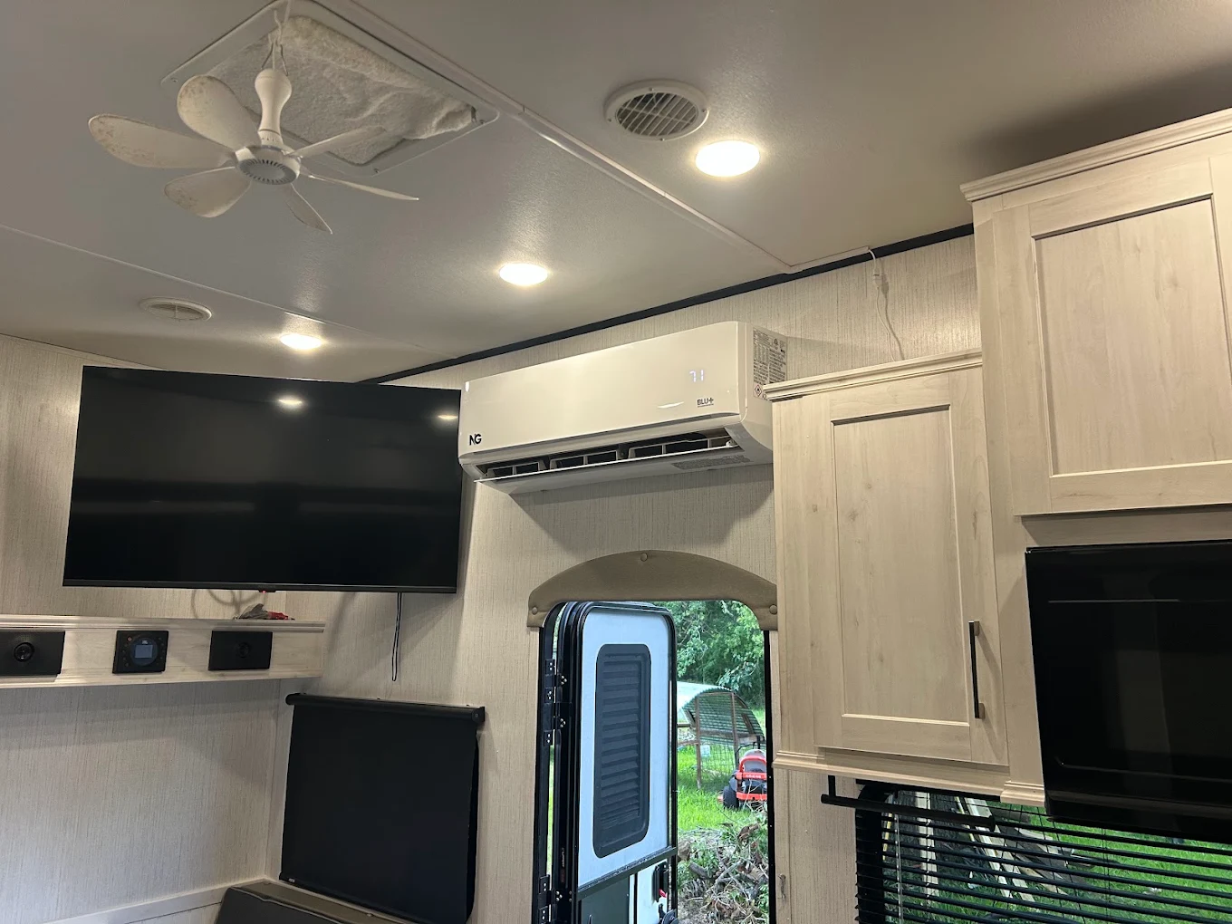 Compact mini split outdoor unit with protective line hide in back patio