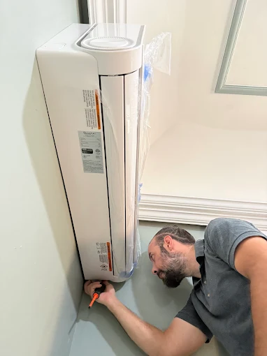 Technician installing indoor ductless mini split unit in Georgetown, TX
