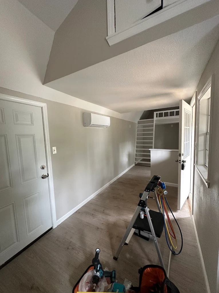 Wall-mounted indoor mini split air handler unit in living space in Cypress home
