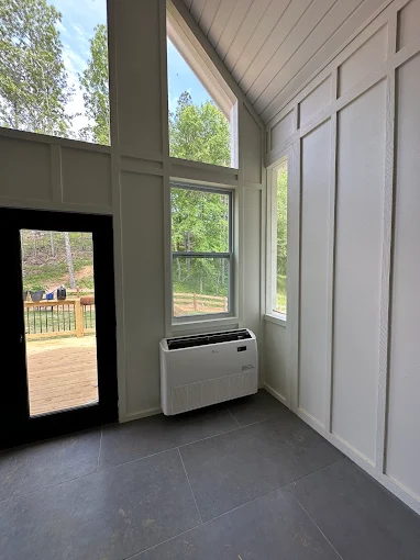 Floor console mini split indoor air handler installed in McKinney room