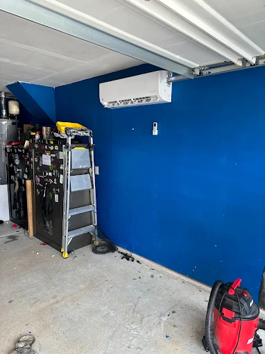 Ductless mini split indoor air handler mounted in garage in Sugar Land