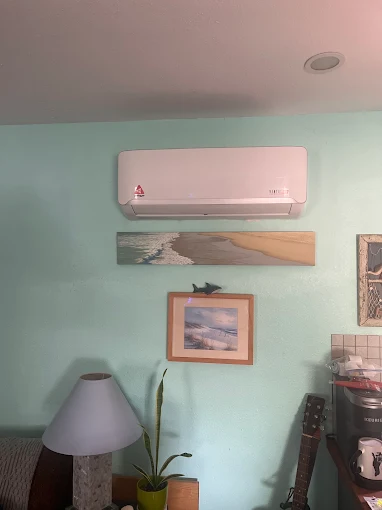 Wall mounted indoor ductless mini split air handler installed in Plano room