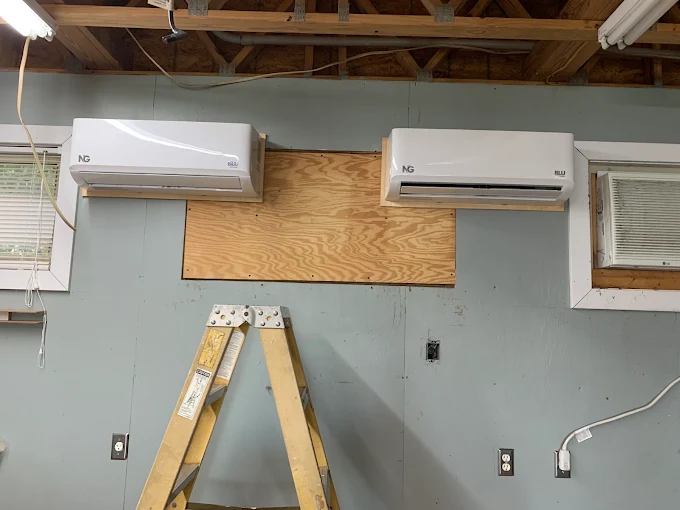 Two indoor ductless mini split air handlers mounted side by side in Pflugerville