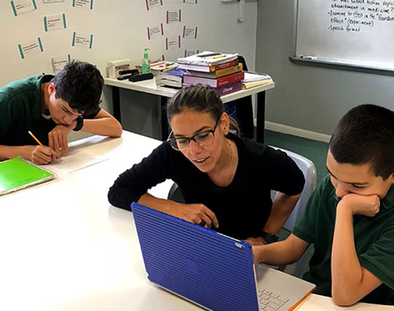 Rosa Rodriguez, Director, working with students