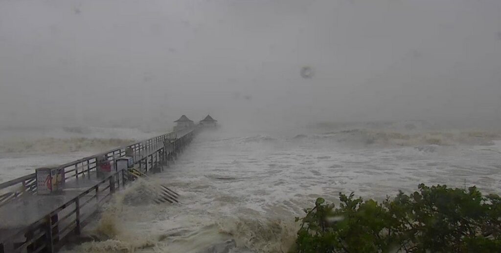 Naples Pier being battered by waves and storm surge during Hurricane Ian on September 28, 2022