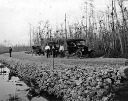 Automobiles traveling along the unfinished Tamiami Trail in 1927.