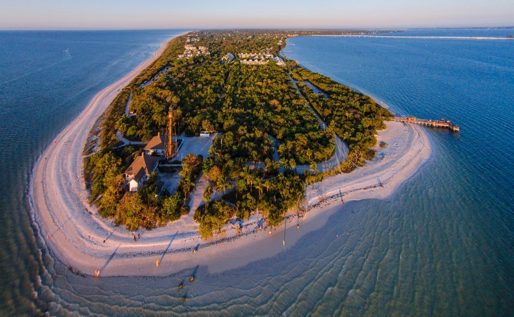 Aerial view of the Sanibel Lighthouse and surrounding coastline.
