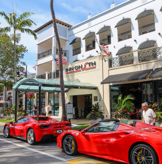 Inn on Fifth and the Naples downtown business district with storefronts and palm-lined streets