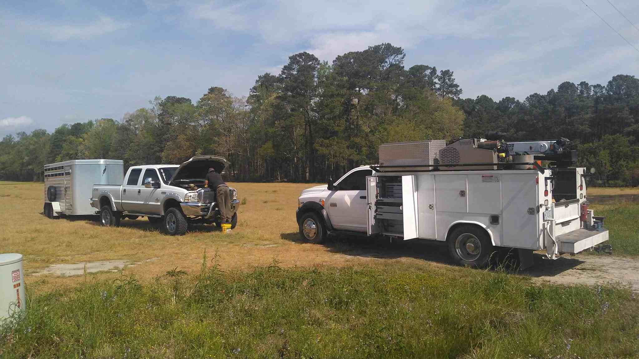 Mobile service truck performing on-site repair in a rural field location