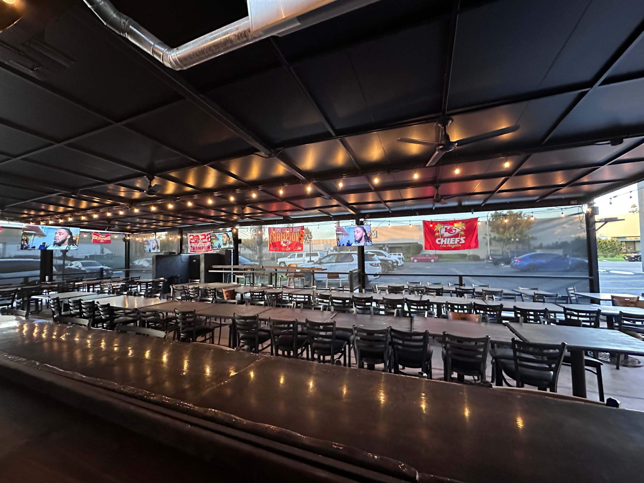 Covered outdoor patio and fire pit seating at My Place Sports Bar & Grill Huntington Beach