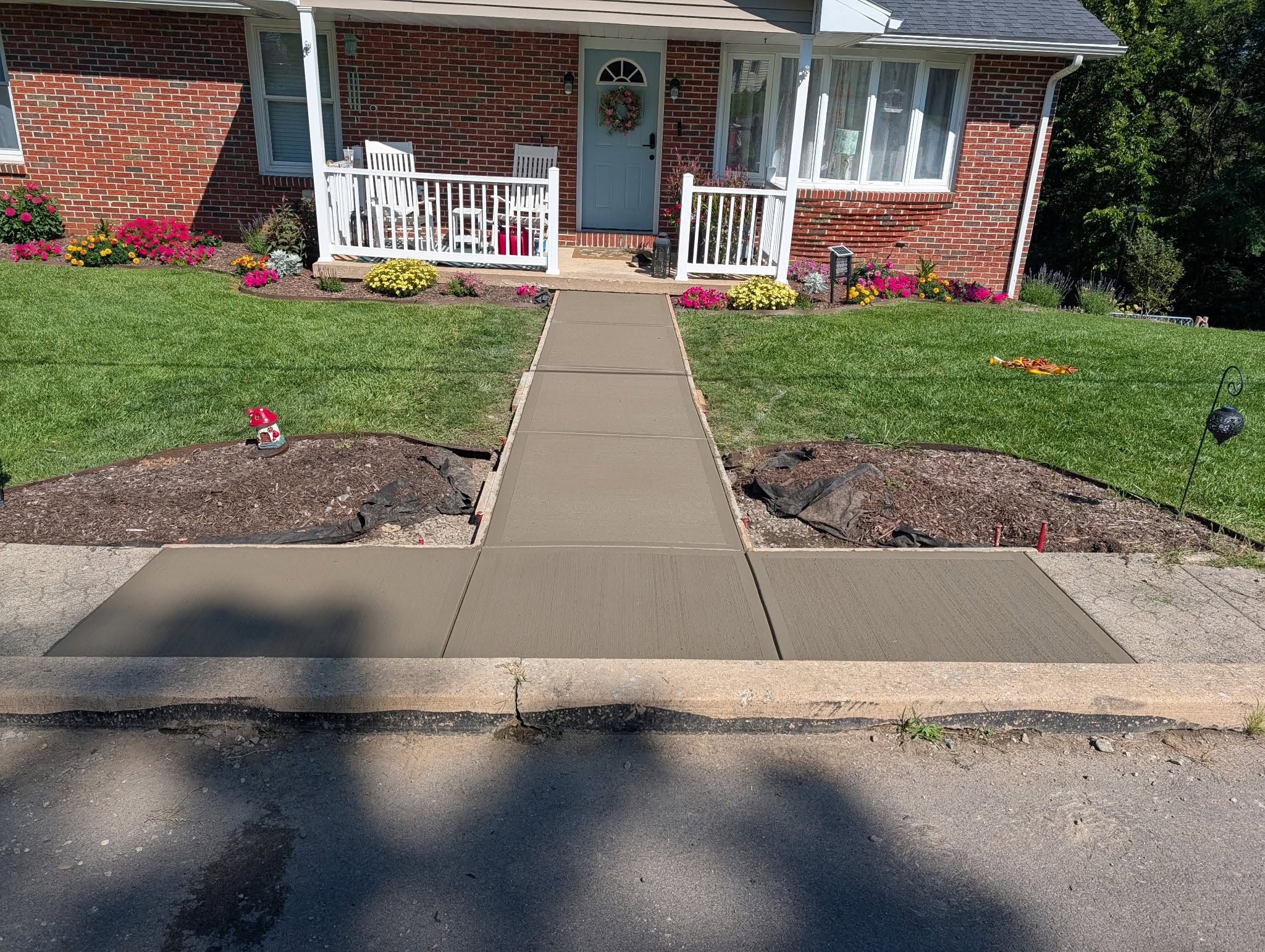 Completed clean broom finish concrete walkway