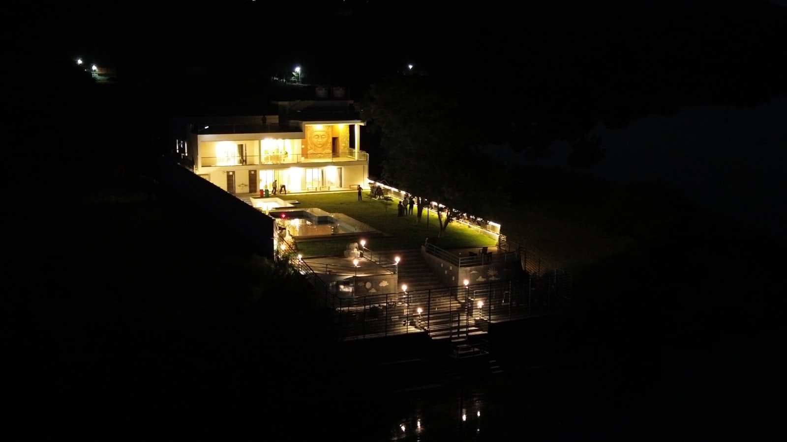 Architectural uplighting on a modern home facade at night