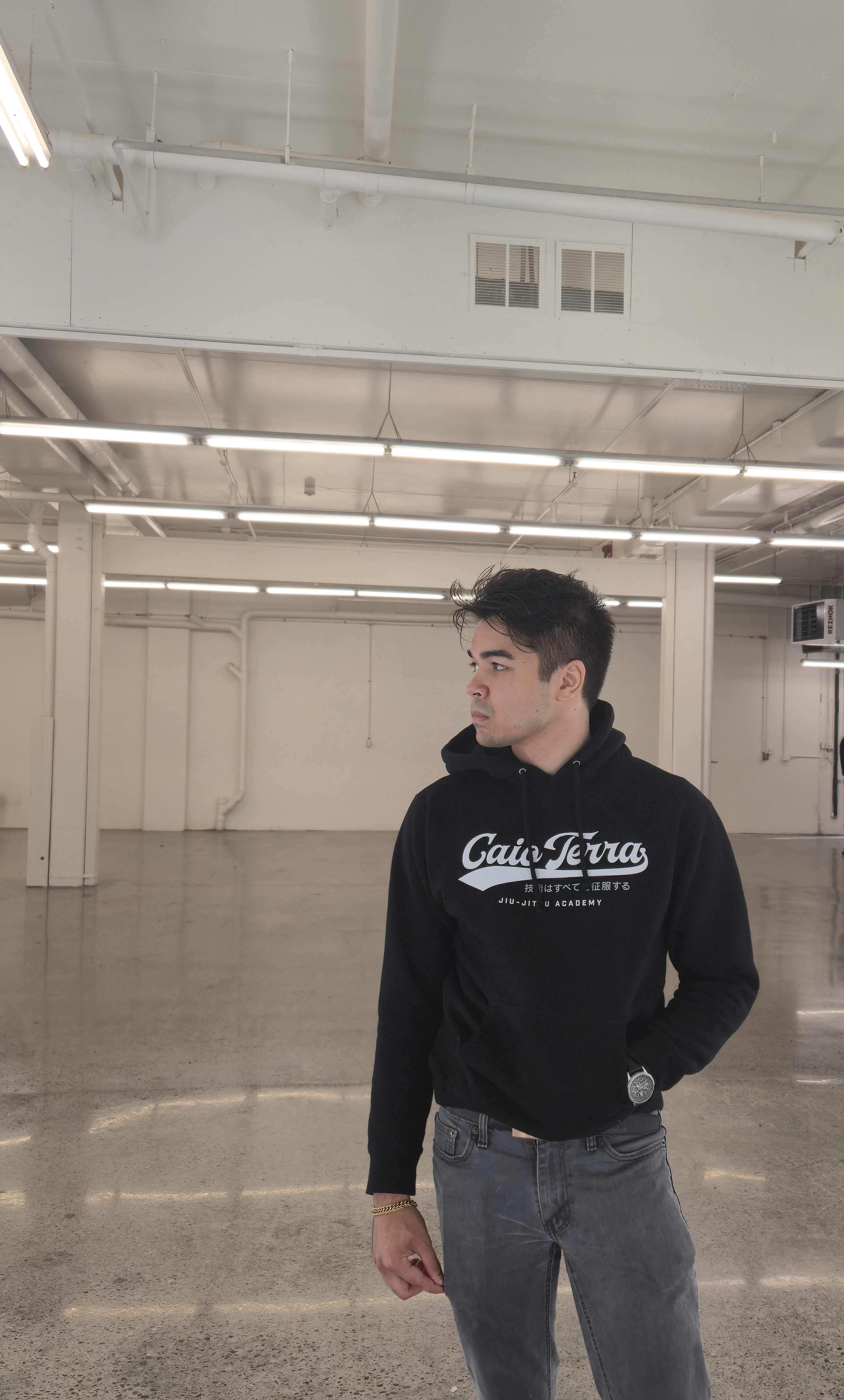 Training floor interior Kirkland Caio Terra Academy — mat area and spring subfloor with coach Ender Cleofe