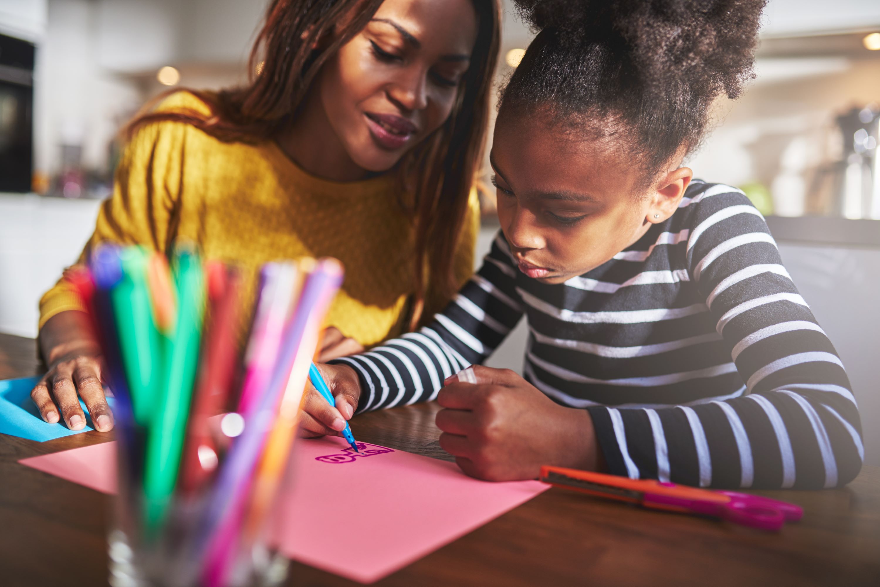 Foster parent helping child with homework