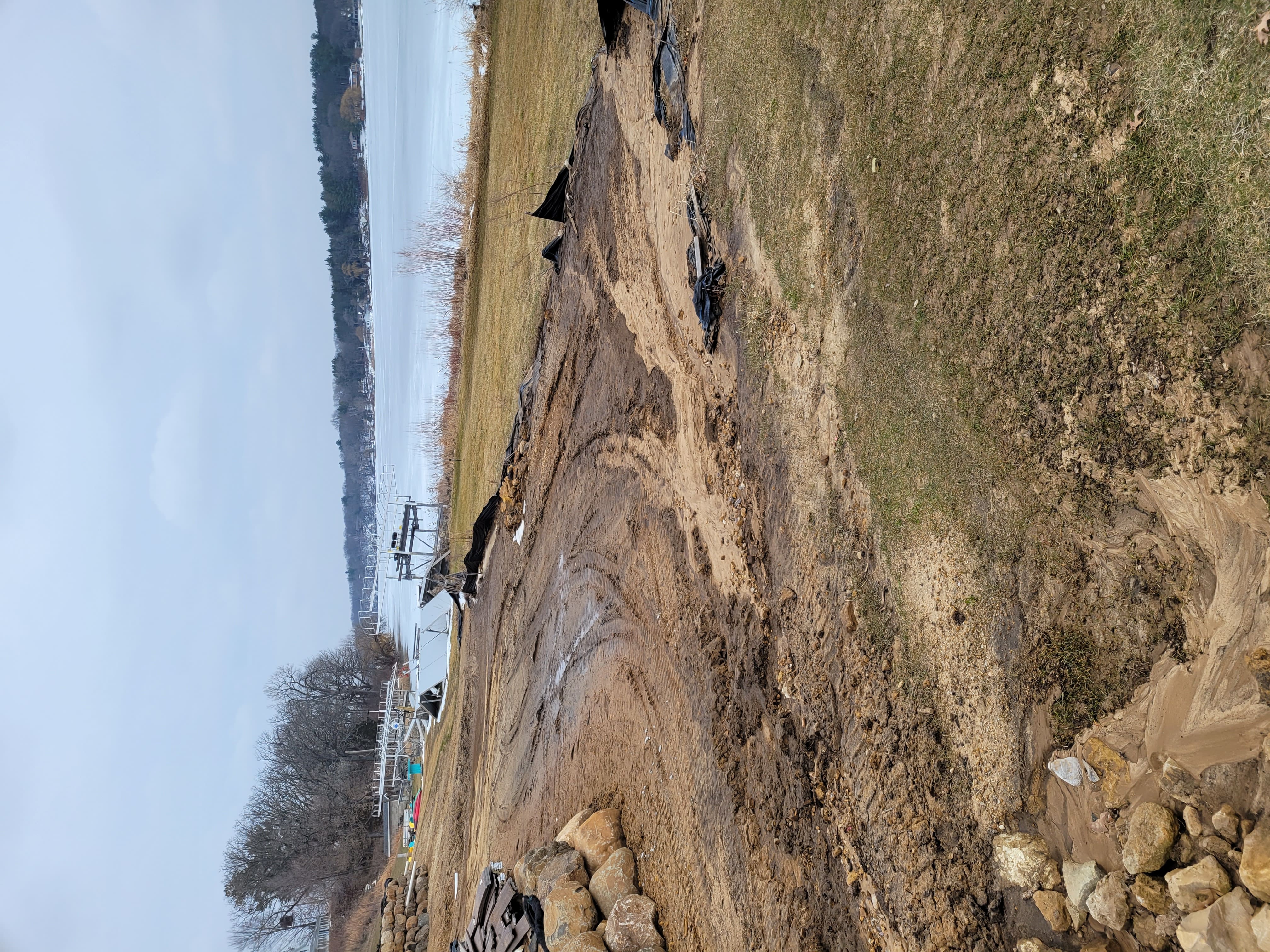 Graded lakeside yard prepped for retaining wall and landscaping in Dane County, WI