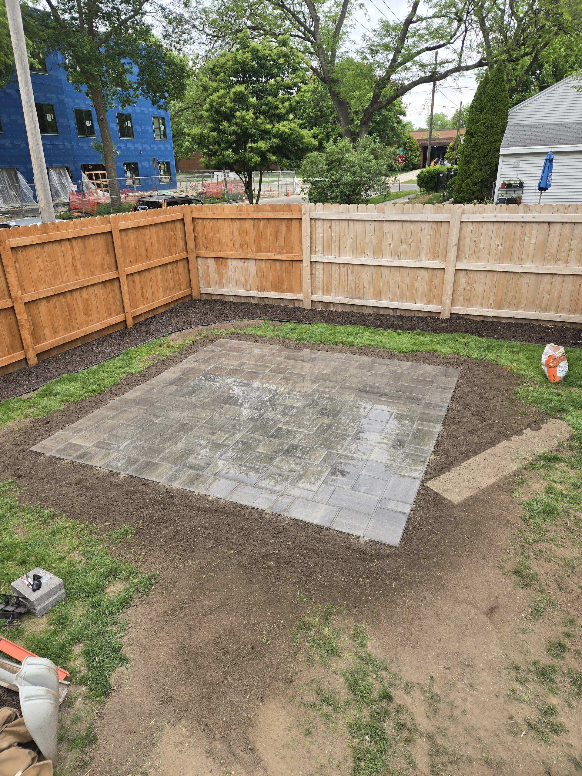 Newly installed paver patio in a fenced backyard in Sun Prairie, WI