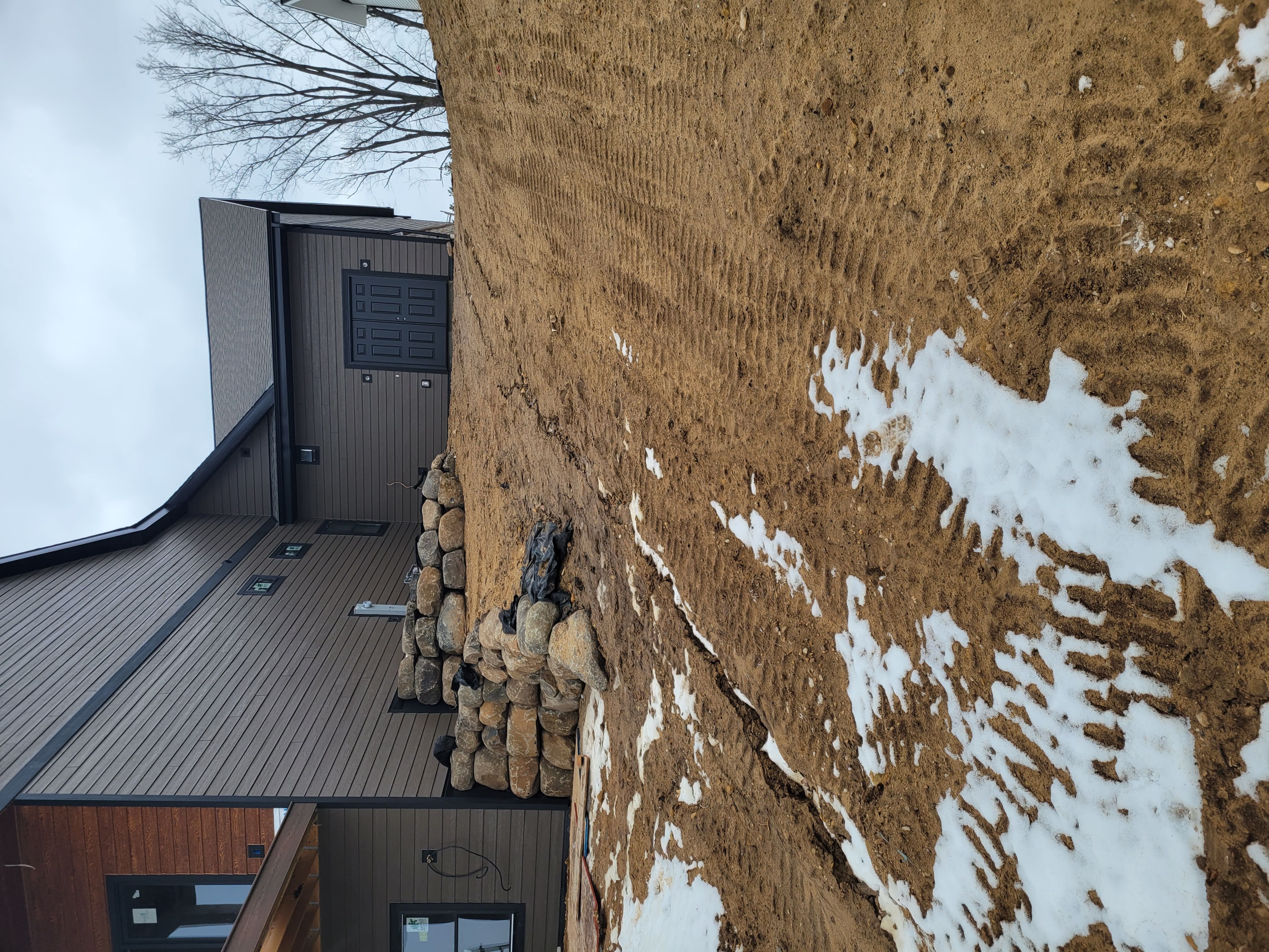 Multi-tiered boulder retaining wall grading project in Dane County, WI