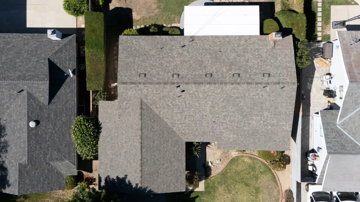 Top-down overhead drone view of finished Malarkey shingle roofline and ridge caps, Chatsworth CA