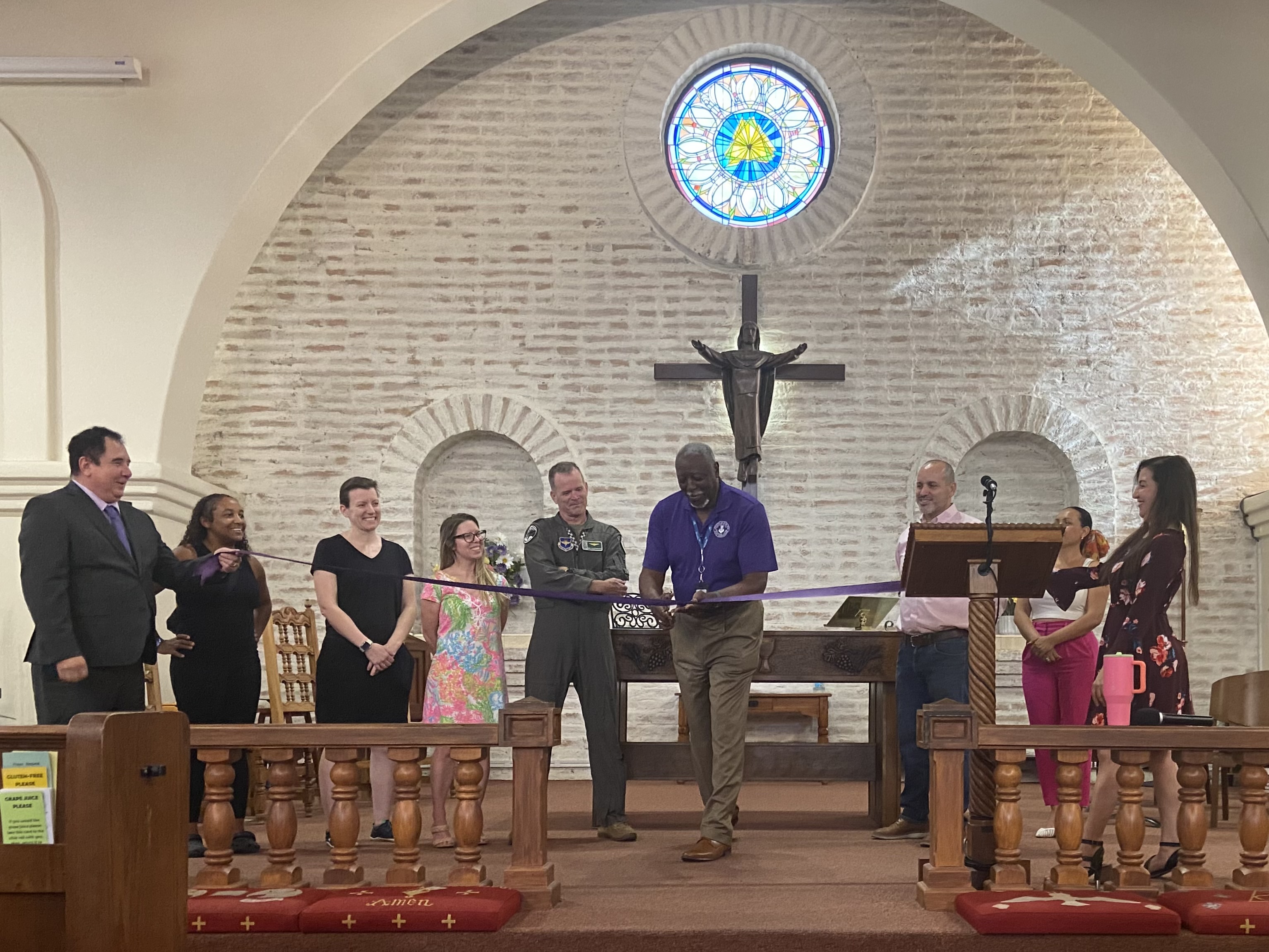 Purple Star ribbon-cutting ceremony inside the church sanctuary with community leaders and military family members