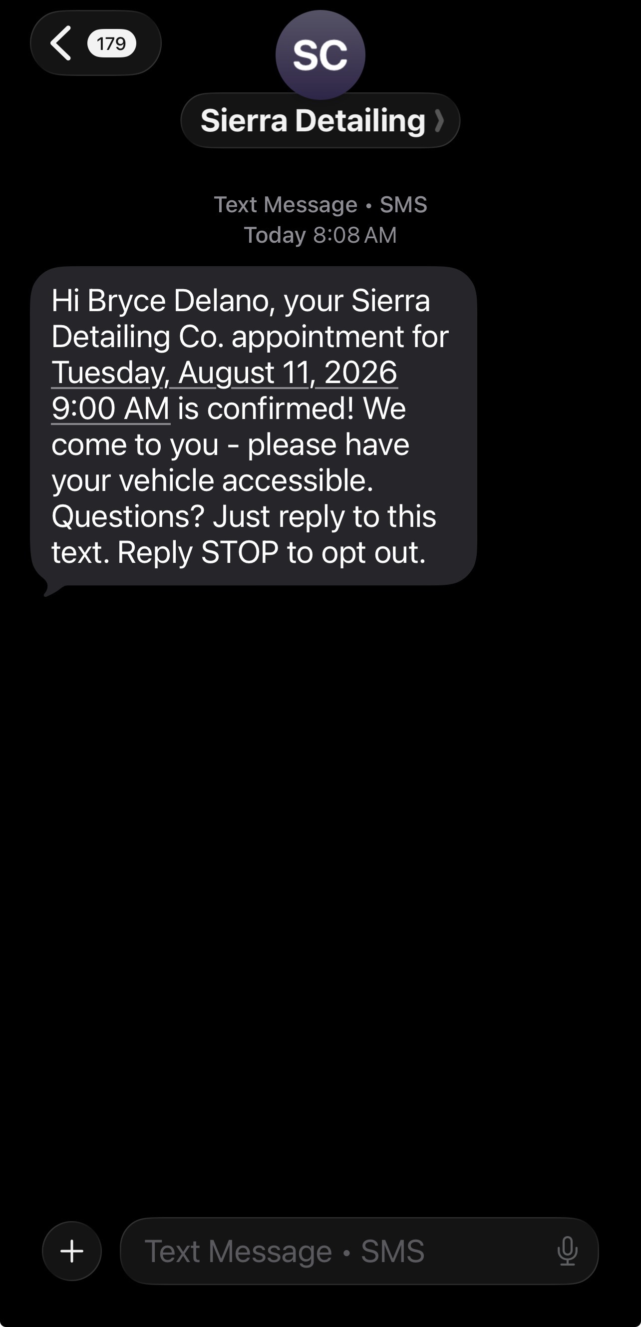 Automated appointment reminder SMS from Sierra Detailing confirming booking details