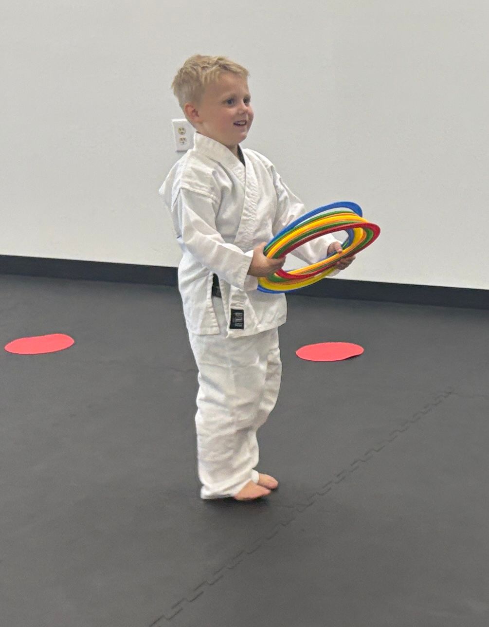 Young child smiling in martial arts class