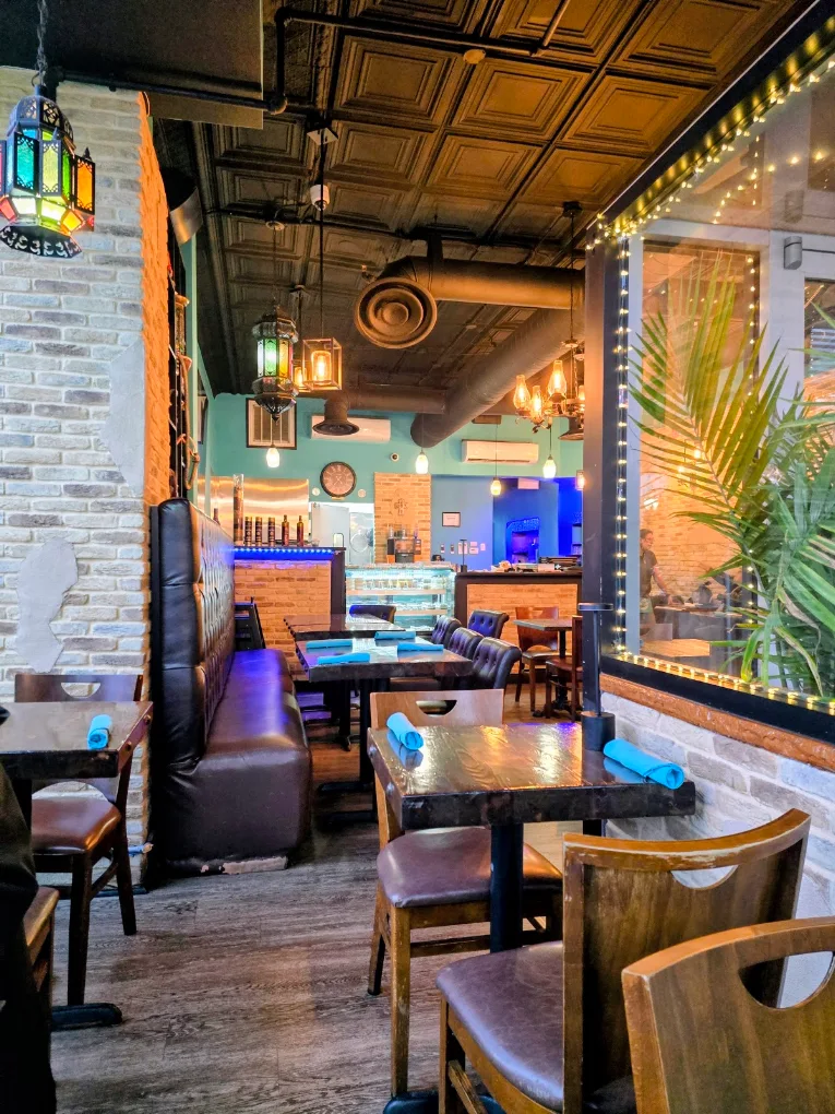 Cozy interior seating and dining tables at Old City Cafe & Grill