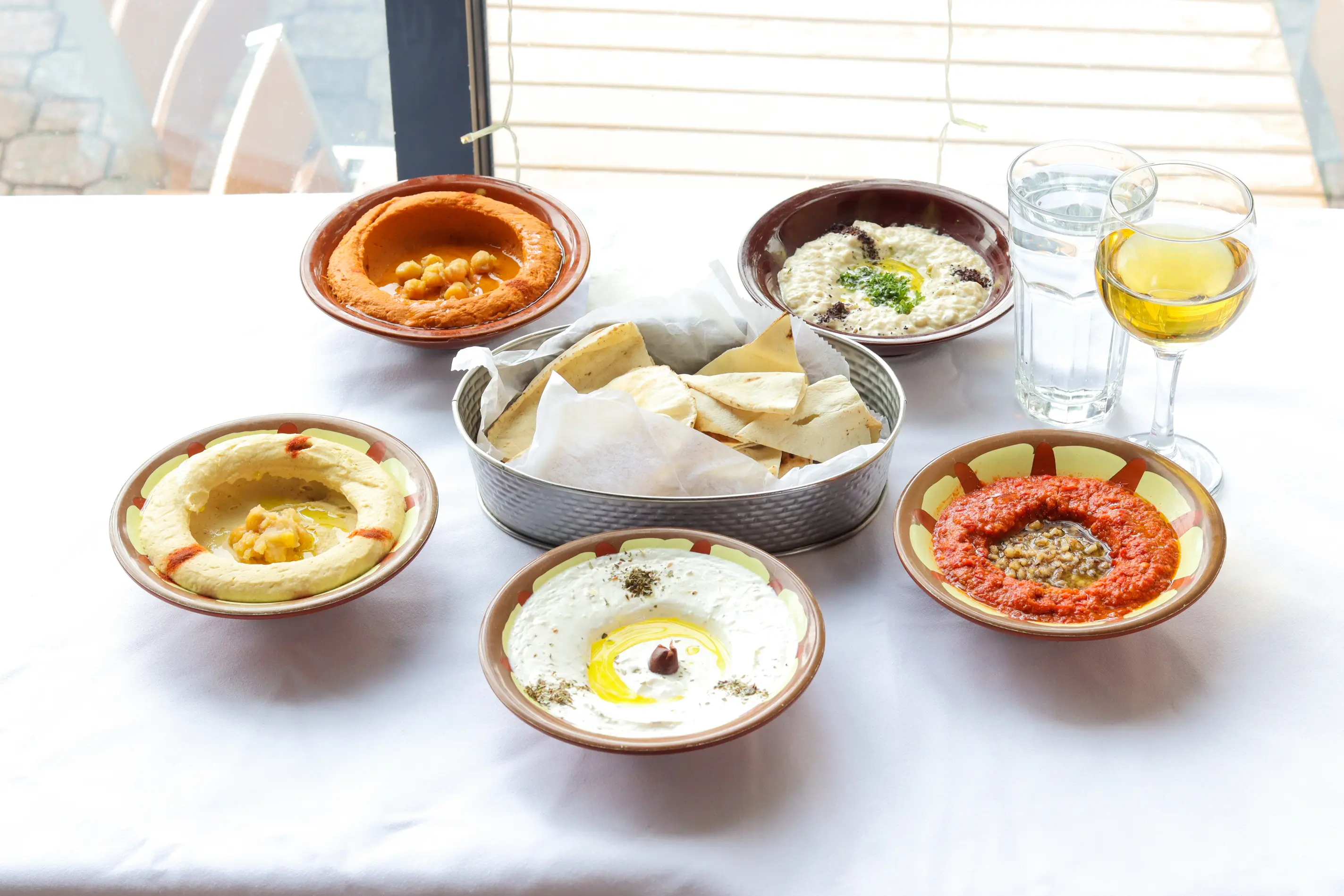 Authentic Mediterranean meze selection with hummus, labneh and warm pita at Old City Cafe & Grill