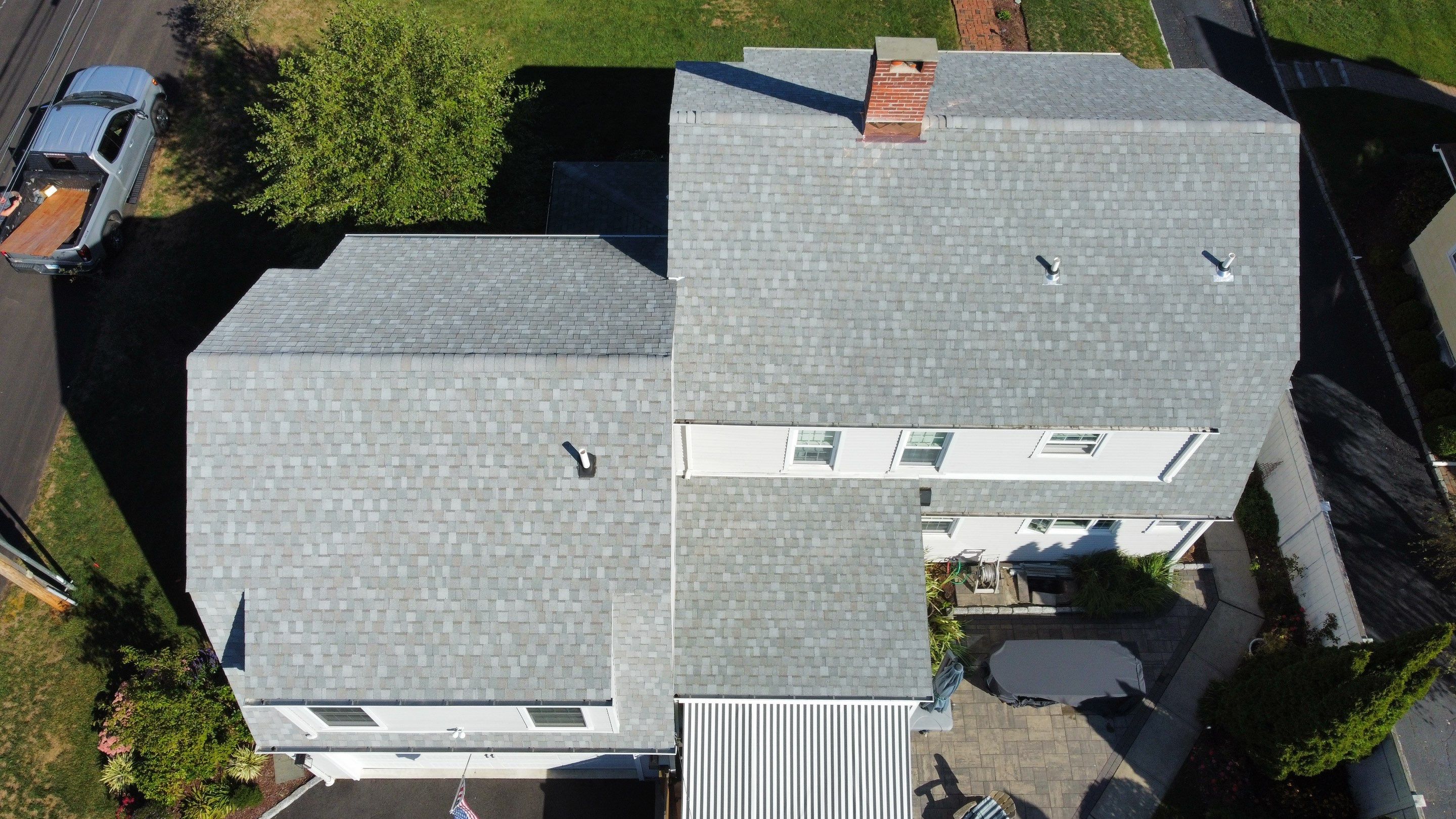 Aerial view of a completed roof replacement by Cooper Modifications in Connecticut