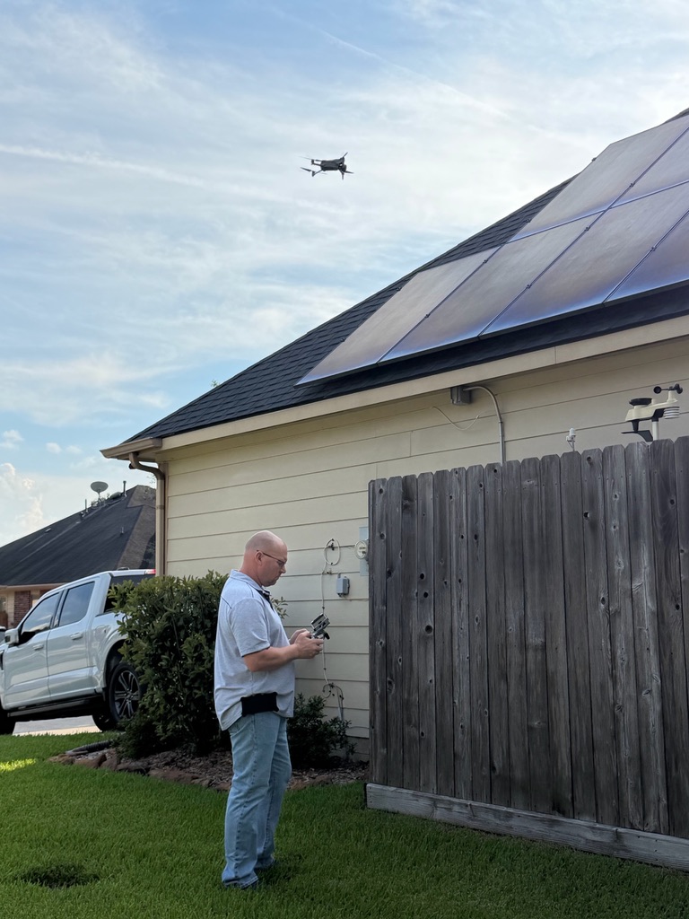 Dave Tague conducting an independent drone roof inspection of a residential home