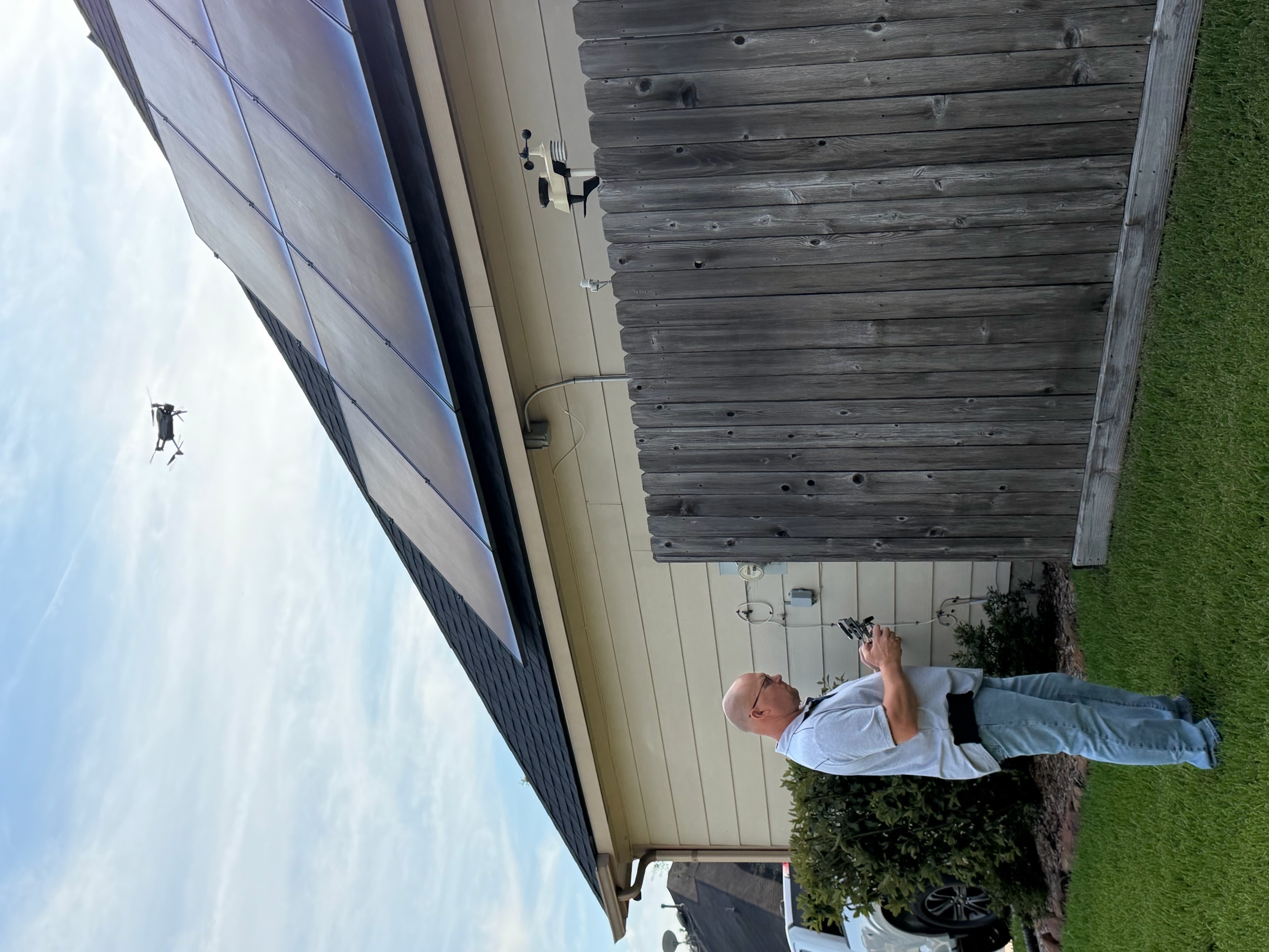 Dave Tague using a drone to inspect a home's roof